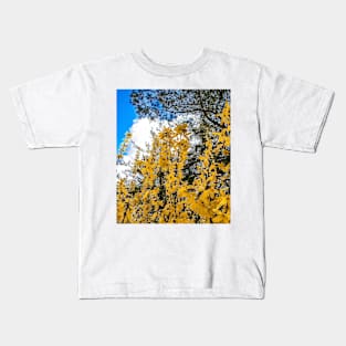 golden flowers in spring nature with blue sky and white clouds Kids T-Shirt